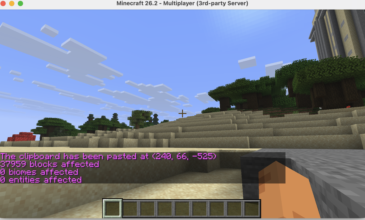 Minecraft in-game chat showing the WorldEdit paste result: clipboard pasted at coordinates with 37,959 blocks affected